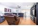 Spacious living room featuring wood floors, comfortable seating, and sliding doors for natural light at 1135 Plato Ave, Orlando, FL 32809