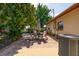 Outdoor patio with brick pavers and a dining set, offering a cozy space for outdoor dining at 1135 Plato Ave, Orlando, FL 32809