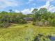Aerial view of the home and property showcasing the large yard and lake access at 120 E Greentree Ln, Lake Mary, FL 32746