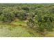 Aerial view of property, lake and pool highlighting the serene and private setting at 120 E Greentree Ln, Lake Mary, FL 32746