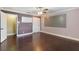Bedroom featuring dark wood floors, light purple walls, crown molding, a ceiling fan and closet at 120 E Greentree Ln, Lake Mary, FL 32746