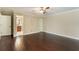 Large bedroom featuring hardwood floors and an ensuite bathroom at 120 E Greentree Ln, Lake Mary, FL 32746