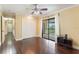 Bedroom featuring hardwood floors, a ceiling fan, and sliding glass doors to the outside at 120 E Greentree Ln, Lake Mary, FL 32746