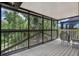 Enclosed deck with view of yard at 120 E Greentree Ln, Lake Mary, FL 32746
