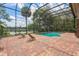 Relaxing backyard pool with screened enclosure and lounge chairs for enjoying sunny days at 120 E Greentree Ln, Lake Mary, FL 32746
