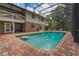 Spacious backyard pool with a seating area, ideal for Gathering fun and entertaining guests at 120 E Greentree Ln, Lake Mary, FL 32746