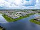 Vast aerial shot of a community featuring houses alongside a network of lakes and lush landscapes at 13822 Destin Beach Ln, Orlando, FL 32827