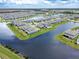 Waterfront community featuring a mix of residential properties, offering serene living and beautiful views at 13822 Destin Beach Ln, Orlando, FL 32827