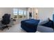 Bright bedroom with a walk-in closet, desk, and lovely outside views from several windows at 13822 Destin Beach Ln, Orlando, FL 32827