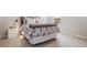 A well-lit bedroom offers a calm ambience with its neutral decor and plush carpeting at 13822 Destin Beach Ln, Orlando, FL 32827