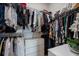 Walk-in closet featuring organized storage solutions and plenty of hanging space for clothing and accessories at 13822 Destin Beach Ln, Orlando, FL 32827