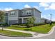 Two-story home boasts meticulous landscaping, lush green grass, and a charming curb appeal at 13822 Destin Beach Ln, Orlando, FL 32827