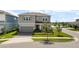 Charming two-story home featuring a well-manicured lawn and a welcoming facade at 13822 Destin Beach Ln, Orlando, FL 32827