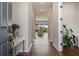 Long hallway leads to a living room and outdoor patio at 13822 Destin Beach Ln, Orlando, FL 32827