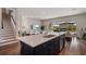 Open concept kitchen with a center island, stainless steel appliances, and a view of the living room at 13822 Destin Beach Ln, Orlando, FL 32827