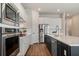 Modern kitchen featuring stainless steel appliances, white cabinets and a view looking into the pantry at 13822 Destin Beach Ln, Orlando, FL 32827
