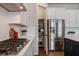 Pantry and refrigerator area featuring stainless steel appliances and a view into the pantry at 13822 Destin Beach Ln, Orlando, FL 32827