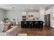 Modern kitchen features an island with seating, stainless steel appliances and white cabinets, perfect for cooking and entertaining at 13822 Destin Beach Ln, Orlando, FL 32827
