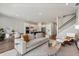 Open-concept living area flows from the living room to the kitchen and dining area, perfect for modern living at 13822 Destin Beach Ln, Orlando, FL 32827