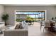 Open-concept living space with seamless transition to the screened outdoor patio and pool area at 13822 Destin Beach Ln, Orlando, FL 32827