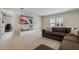 This living room boasts neutral tones, a large sectional sofa, and ample natural light at 13822 Destin Beach Ln, Orlando, FL 32827