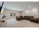 Expansive living area features a large sectional sofa, neutral tones and abundant natural light at 13822 Destin Beach Ln, Orlando, FL 32827