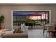 Cozy living room showcasing outdoor sunset views from the screened lanai and patio at 13822 Destin Beach Ln, Orlando, FL 32827