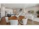 Open-concept area includes the kitchen, dining, and living area, complete with stairs, ideal for entertaining and modern living at 13822 Destin Beach Ln, Orlando, FL 32827