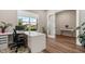 Office featuring a desk, chair, and laminate flooring at 13822 Destin Beach Ln, Orlando, FL 32827