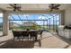 Screened patio with outdoor dining area overlooking the pool and backyard with scenic views at 13822 Destin Beach Ln, Orlando, FL 32827