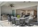 Covered outdoor patio with a grill, kitchen area, and a view into the home's living spaces at 13822 Destin Beach Ln, Orlando, FL 32827