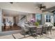 Spacious covered patio offering views into the house and a serene outdoor dining and living area at 13822 Destin Beach Ln, Orlando, FL 32827