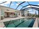 Beautiful screened-in backyard pool and lanai area, perfect for outdoor entertaining and relaxation at 13822 Destin Beach Ln, Orlando, FL 32827