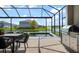 Outdoor pool area with a built-in grill and scenic views of the lake at 13822 Destin Beach Ln, Orlando, FL 32827