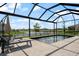 Relaxing backyard pool area with comfortable lounge chairs and a calming view of the lake at 13822 Destin Beach Ln, Orlando, FL 32827