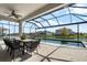 Stunning view of the screened-in backyard pool and patio, perfect for relaxing and entertaining at 13822 Destin Beach Ln, Orlando, FL 32827