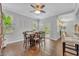 Bright dining room features hardwood floors, a modern ceiling fan, and sliding door access at 1576 Crosswind Cir, Orlando, FL 32825