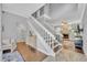 Bright foyer with staircase, wood floors, and open view into the living area at 1576 Crosswind Cir, Orlando, FL 32825