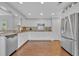Spacious kitchen featuring granite countertops, stainless steel appliances, and hardwood flooring at 1576 Crosswind Cir, Orlando, FL 32825