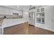 Bright kitchen featuring stainless steel appliances, granite countertops and white cabinetry at 1576 Crosswind Cir, Orlando, FL 32825