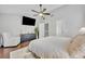 Bright main bedroom showcasing a ceiling fan, hardwood floors, walk in closet and neutral decor at 1576 Crosswind Cir, Orlando, FL 32825