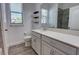 Bathroom featuring a vanity, framed mirror, wood-look flooring, toilet, and wood shelves at 1727 Butterfly Way, Longwood, FL 32750