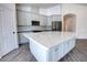 Spacious kitchen featuring a large island, stainless steel appliances, and plenty of storage at 1727 Butterfly Way, Longwood, FL 32750