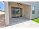 Covered patio with brick flooring, sliding glass doors, columns, and a view of the backyard at 1727 Butterfly Way, Longwood, FL 32750