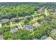 Aerial view of houses in a lush, wooded suburban neighborhood at 1745 Seneca Blvd, Winter Springs, FL 32708
