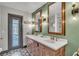 Bathroom features double sinks, decorative mirrors, and a tiled floor at 1745 Seneca Blvd, Winter Springs, FL 32708