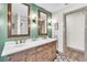 Bathroom features double sinks, decorative mirrors, and an accented wall at 1745 Seneca Blvd, Winter Springs, FL 32708