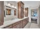 Bright bathroom with double vanity sinks, marble countertops, and a walk-in closet at 1745 Seneca Blvd, Winter Springs, FL 32708