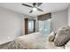 Comfortable bedroom featuring a ceiling fan, wooden floors, and a spacious closet at 1745 Seneca Blvd, Winter Springs, FL 32708