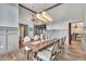 Elegant dining room features high ceilings, modern light fixture, and large windows at 1745 Seneca Blvd, Winter Springs, FL 32708